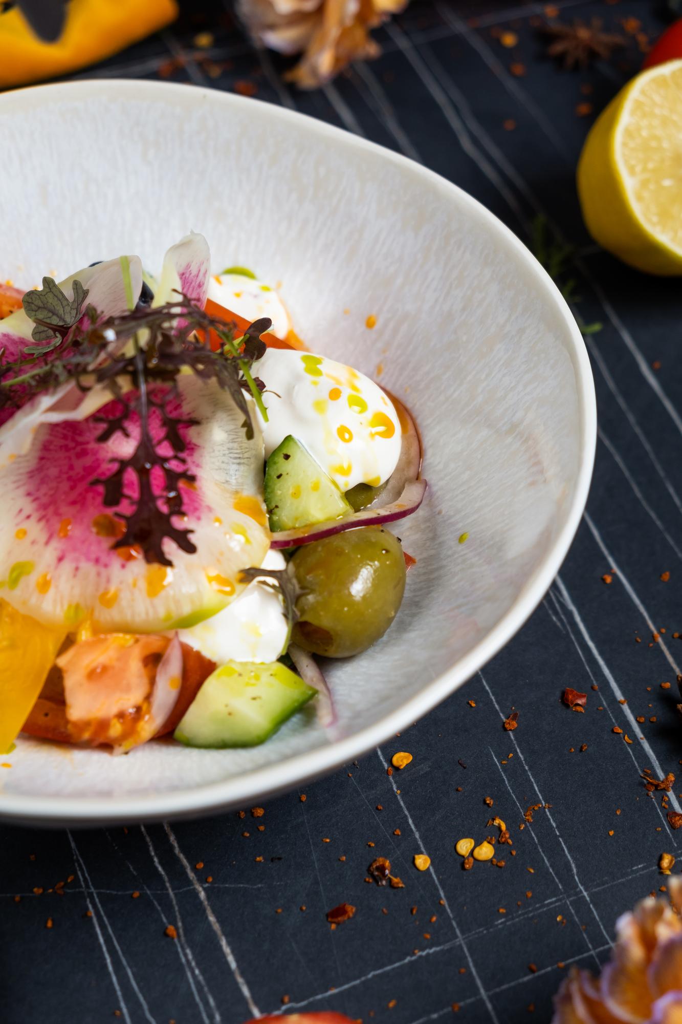 Close-up of plated seasonal dish on a ceramic plate